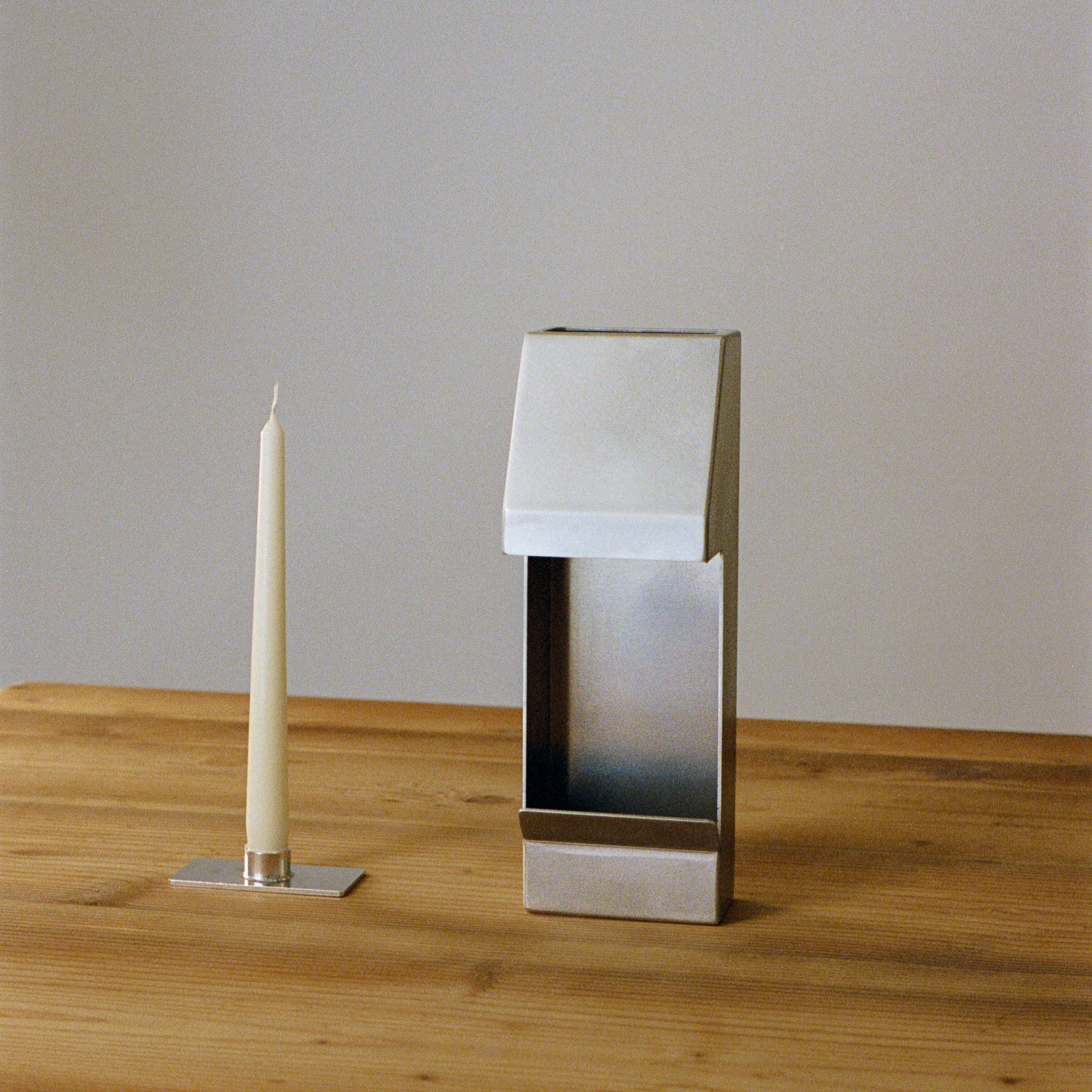 Six taper candles in a bundle by PARCTA, featuring elegant white wax and classic candle shapes for decorative or lighting use.