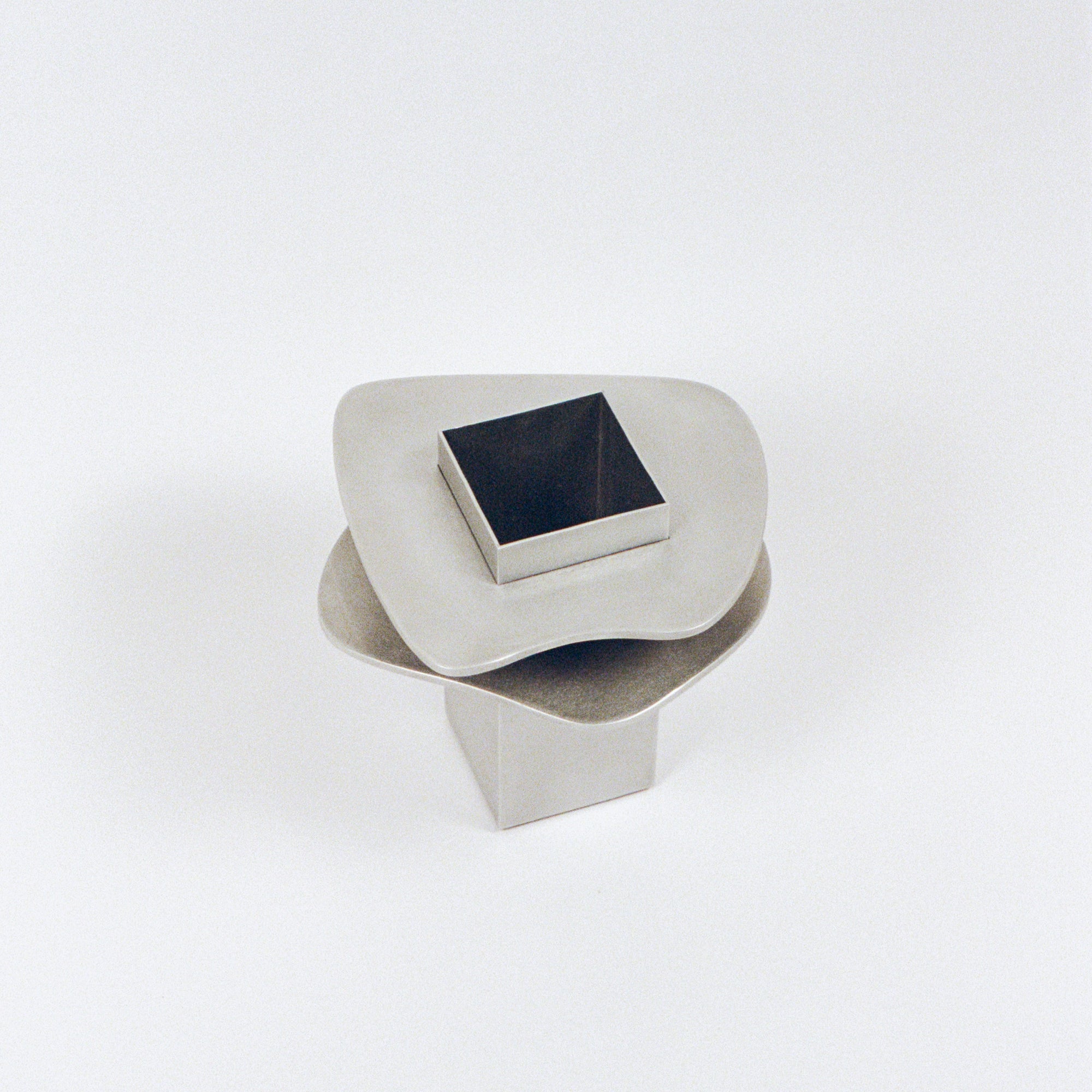 PARCTA flange vase with smooth ceramic surface and modern design, shown with a narrow opening and rounded body.