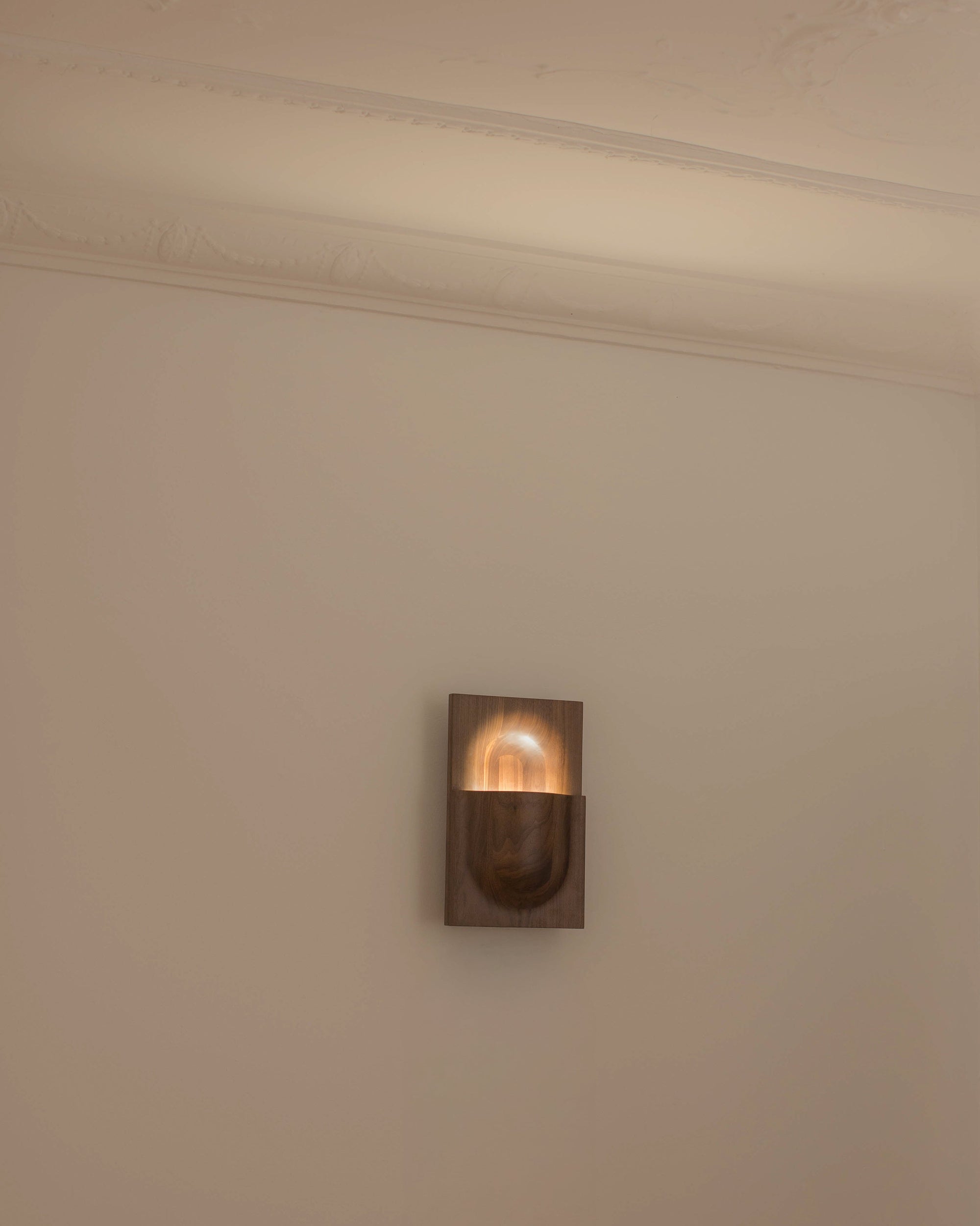 PARCTA Circuit Sconce wall light with sleek, modern design mounted on a wall, featuring a minimalist metal shade.