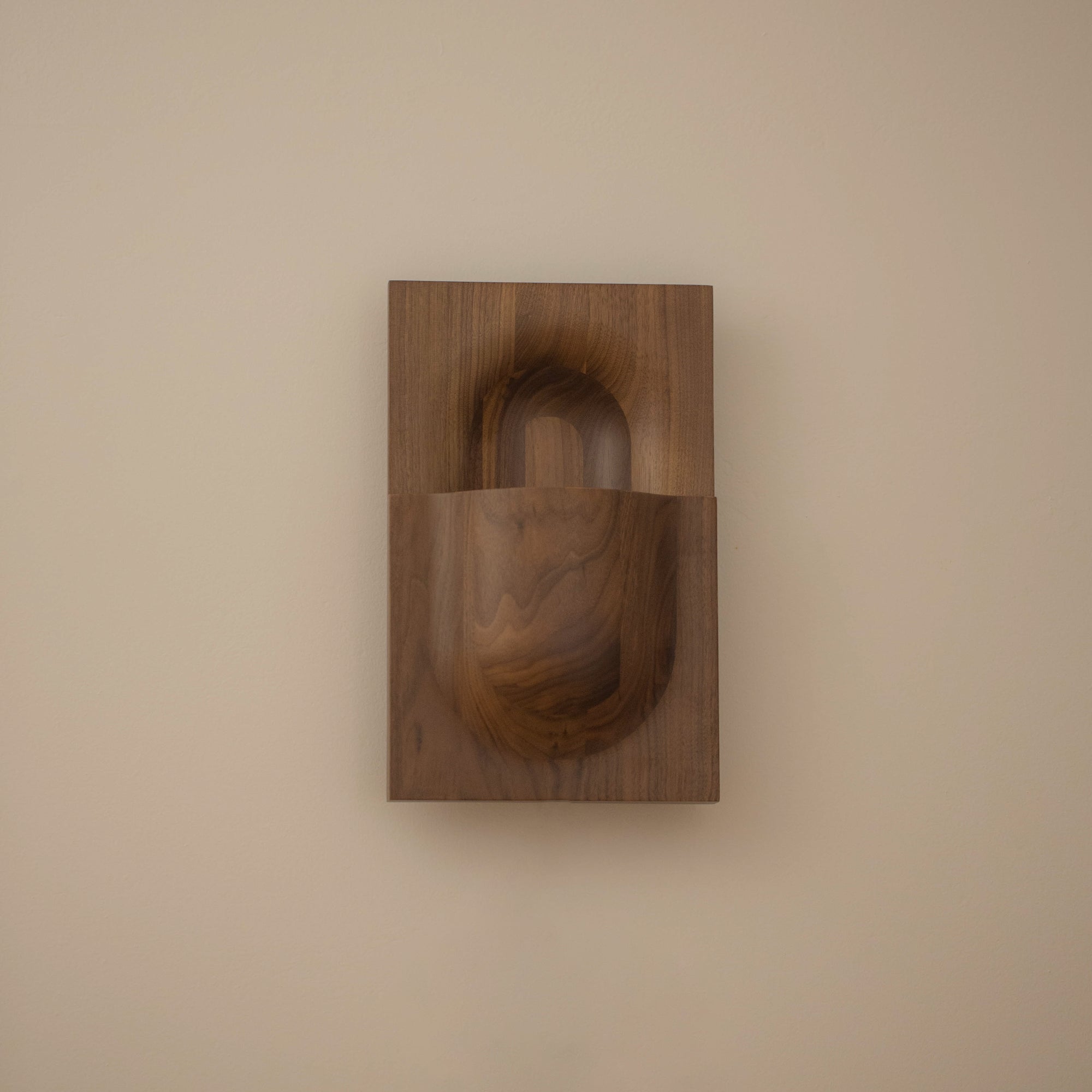 PARCTA Circuit Sconce wall light mounted on a wall, featuring a modern design with a sleek metal finish and ambient lighting.